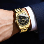 Gold tone BINBOND men’s watch with classic fluted bezel and calendar