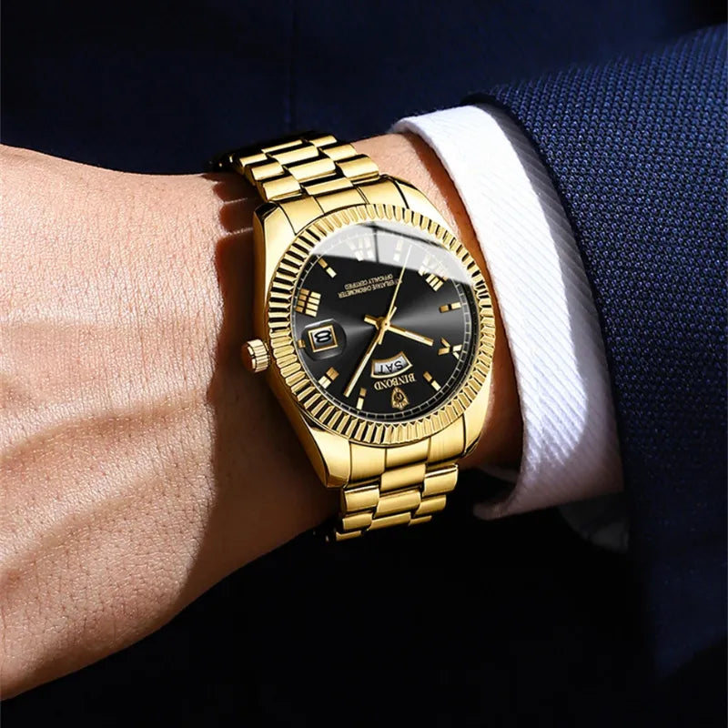 Gold tone BINBOND men’s watch with classic fluted bezel and calendar
